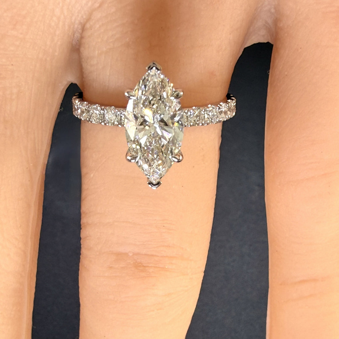 2.25ct marquise cut diamond engagement ring on finger
