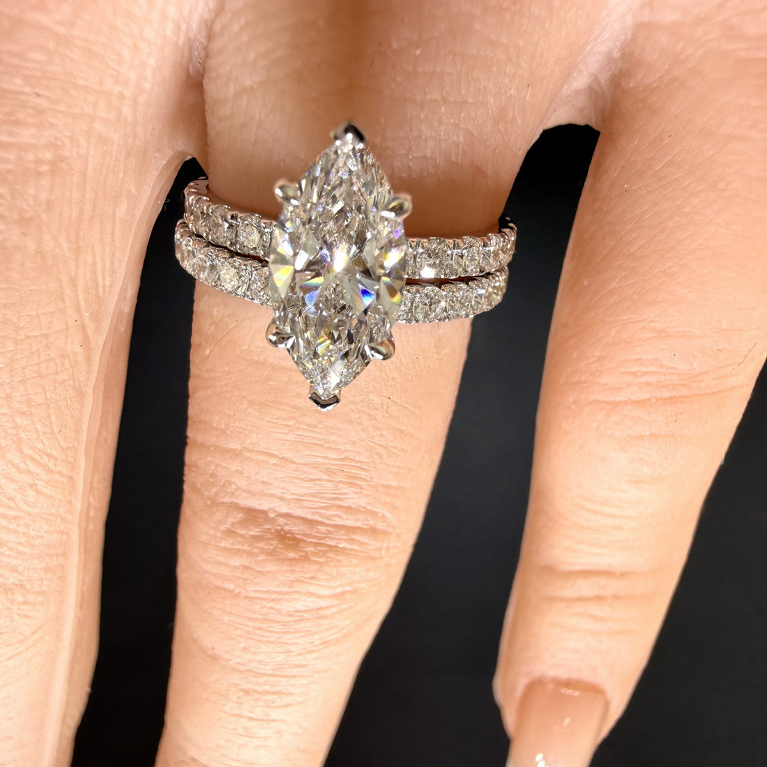 2.25ct marquise cut diamond engagement ring in finger