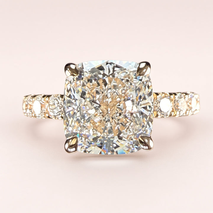 A softly squared 3ct cushion-cut lab-grown diamond with 1.05ct of pavé sparkle, finished in 14K yellow gold for a romantic 4.05 CTW statement.