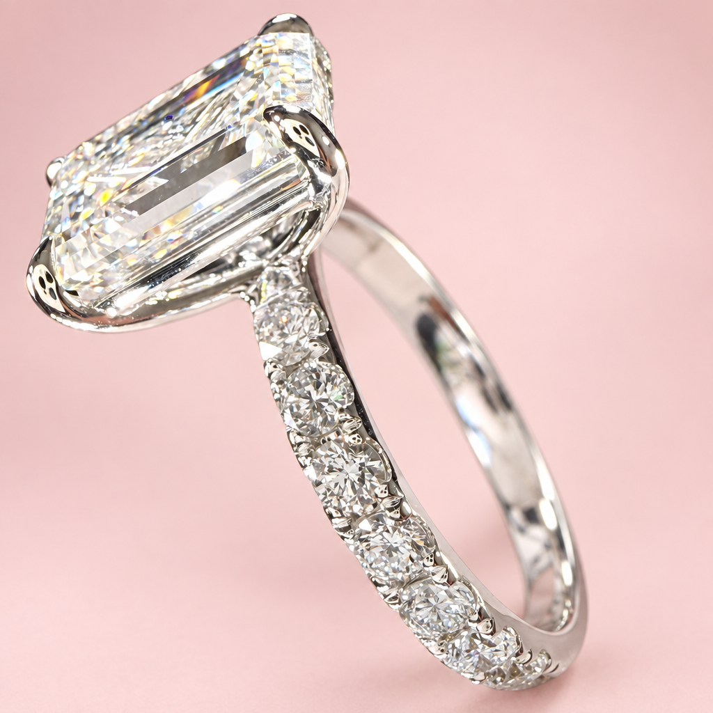 Emerald-cut ring side view with pink background