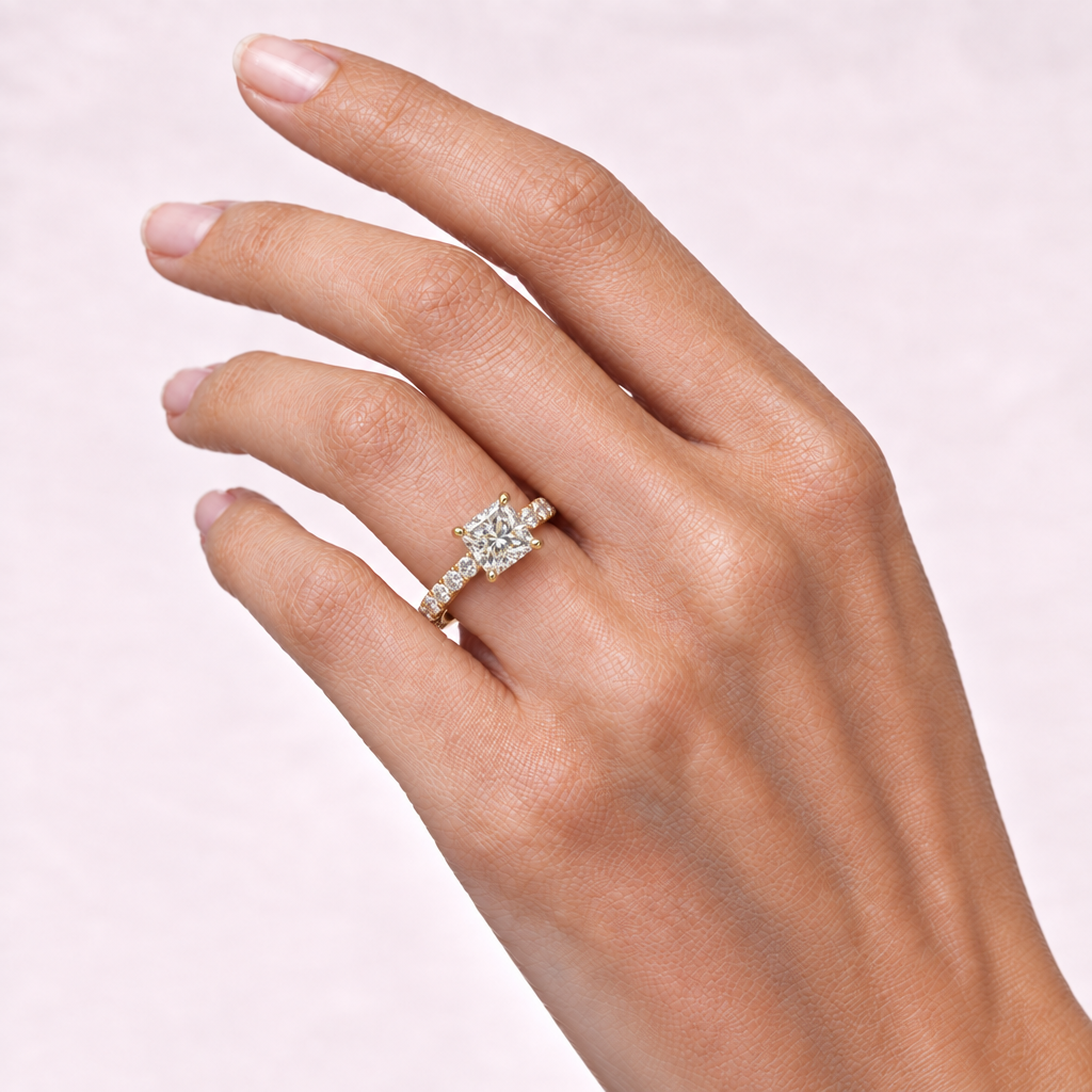 Hand wearing princess-cut diamond-band ring