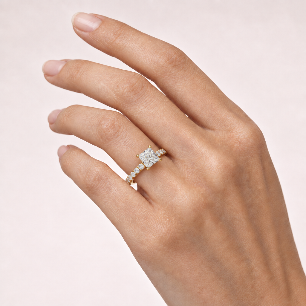 Hand wearing princess-cut pavé ring