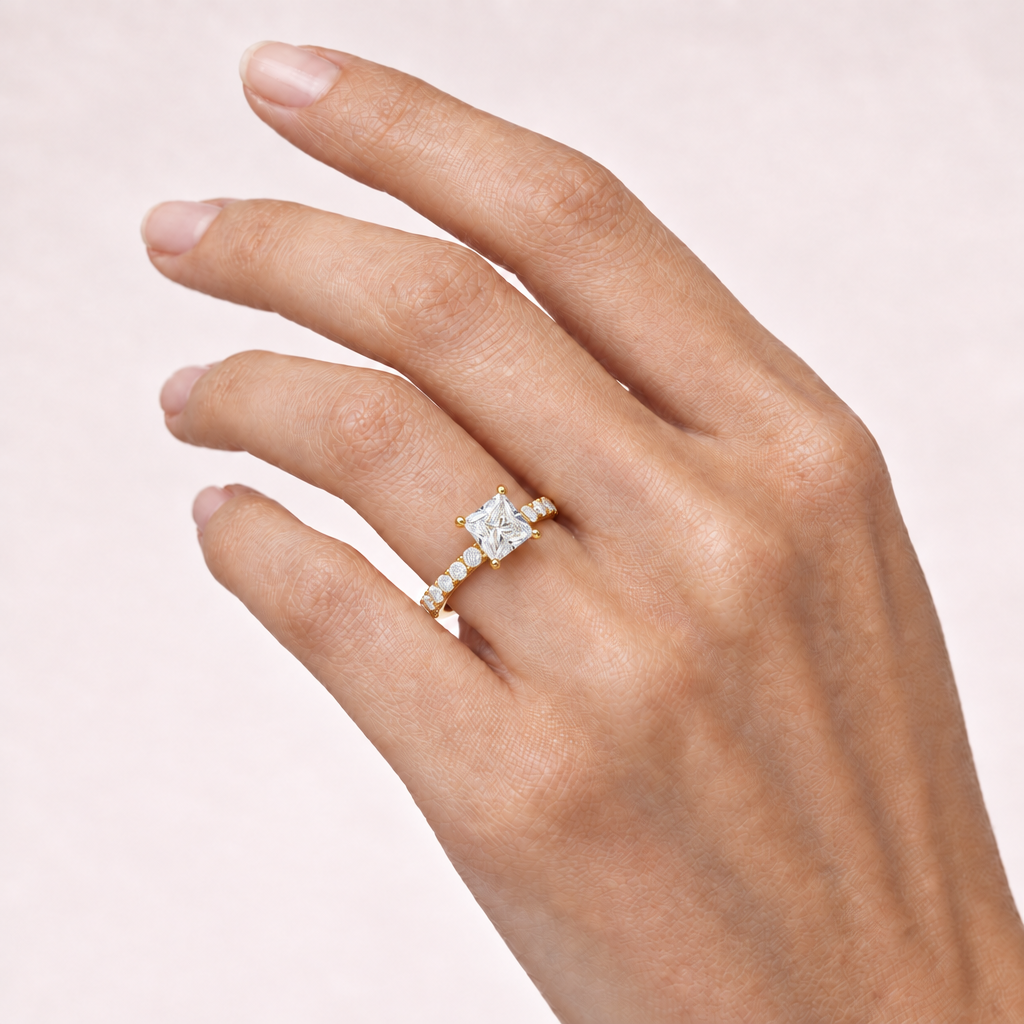 Hand wearing princess-cut pavé ring