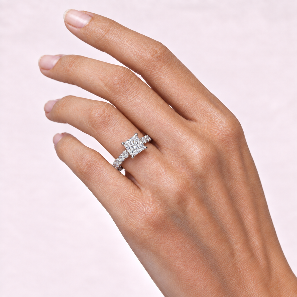 Hand wearing white-metal princess-cut ring