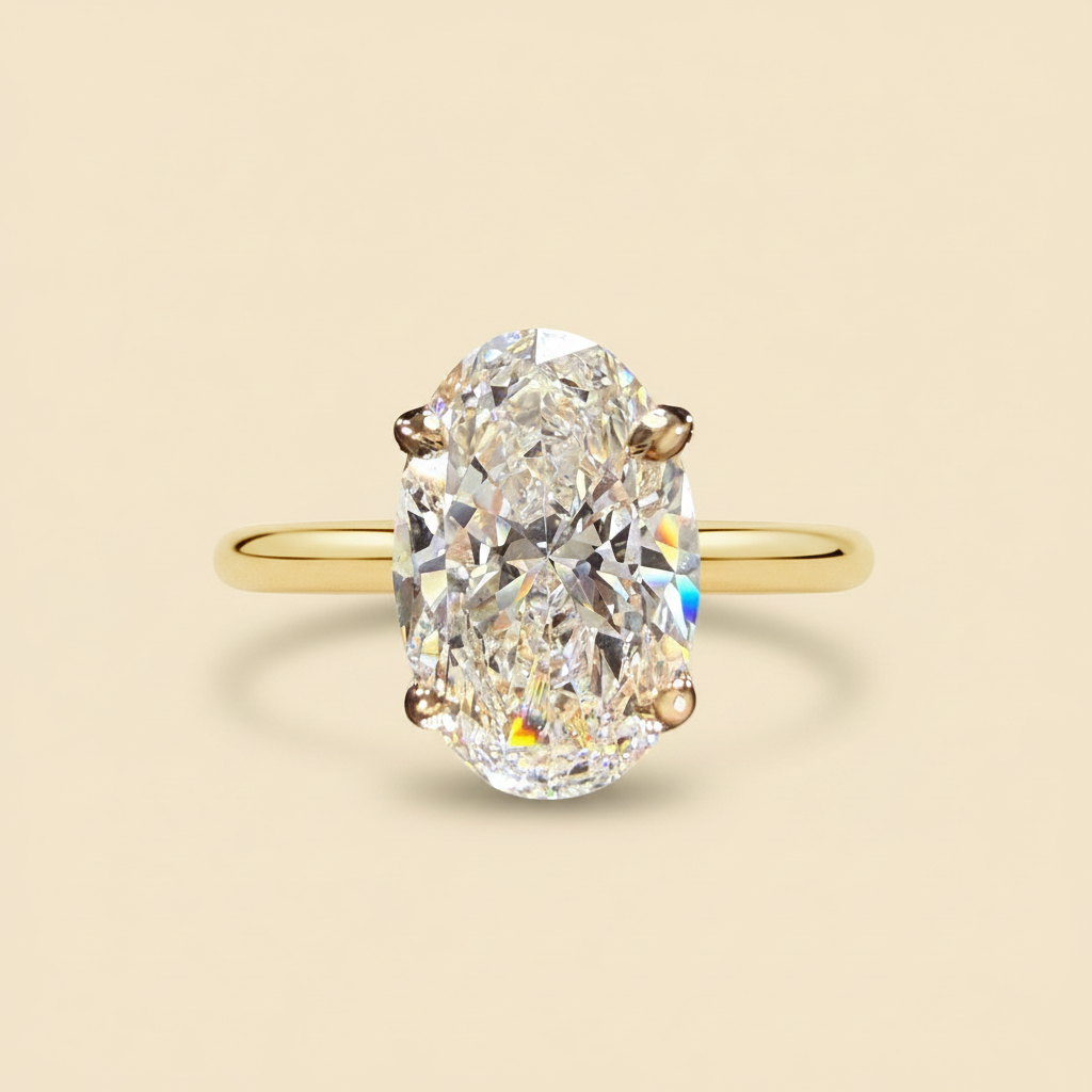 Oval-cut yellow gold solitaire ring side view