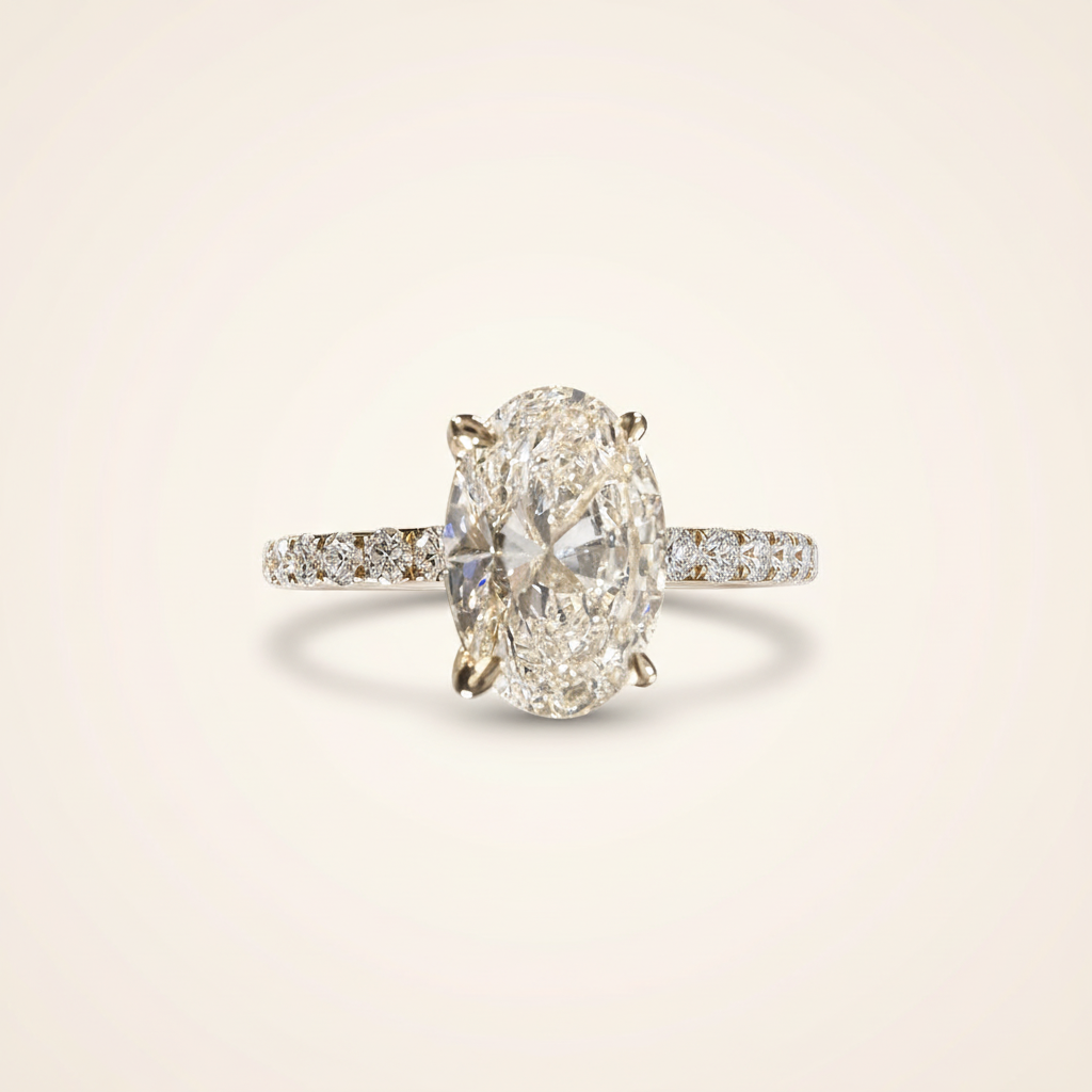 3.77ct oval lab-grown diamond ring on blush studio background