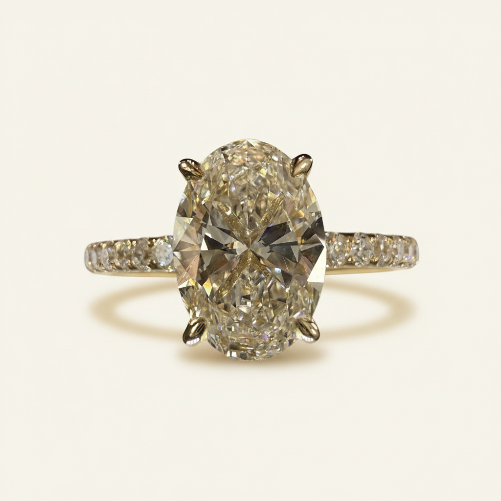 Oval-cut yellow gold engagement ring side view