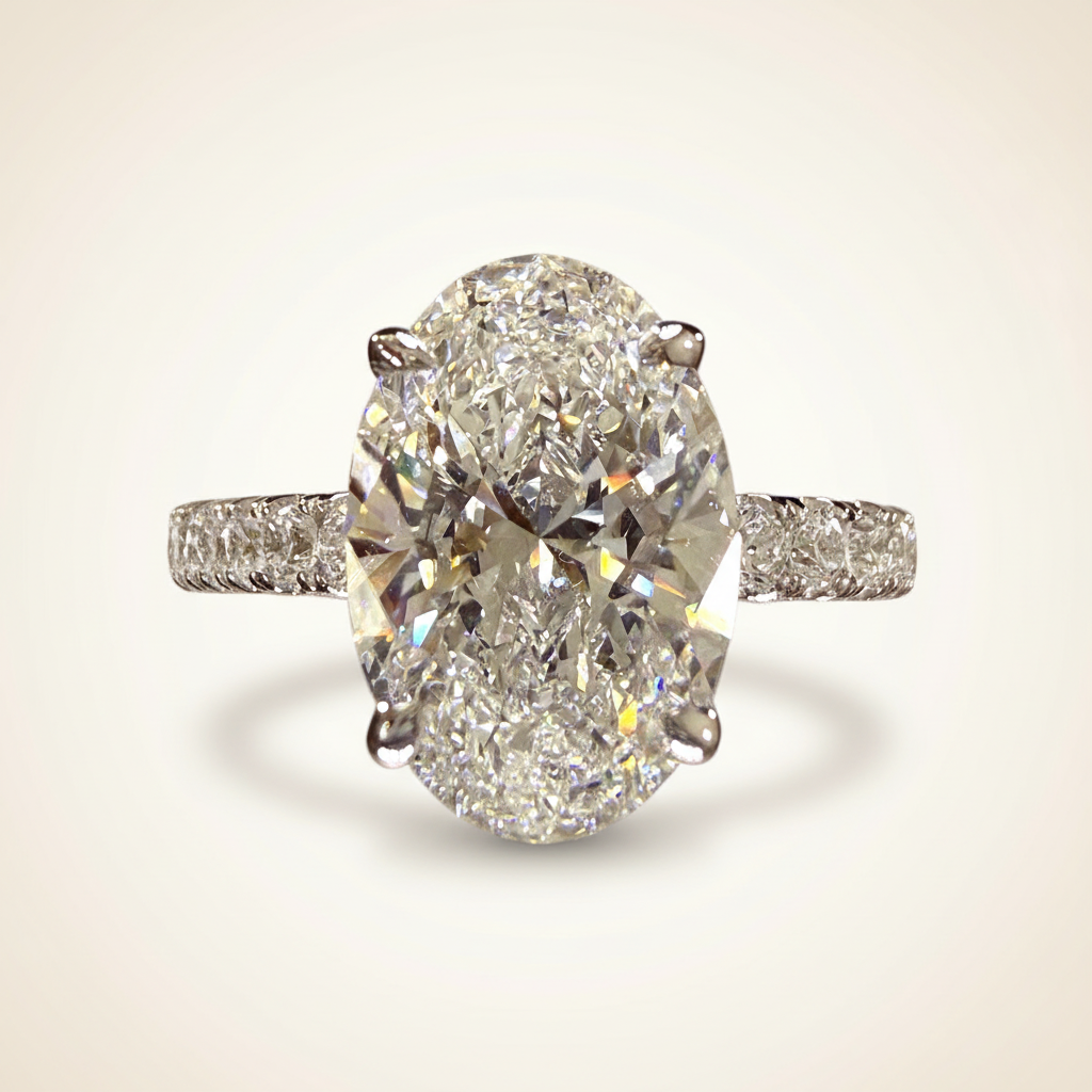 Oval-cut white gold engagement ring side view