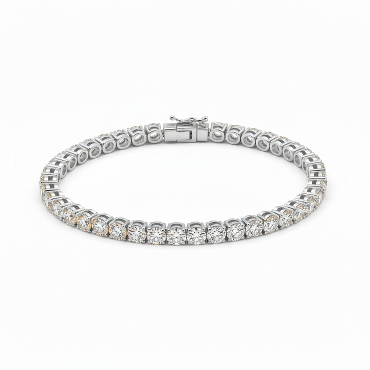 White-gold tennis bracelet arranged in an oval showing round diamonds and the clasp on a white background.