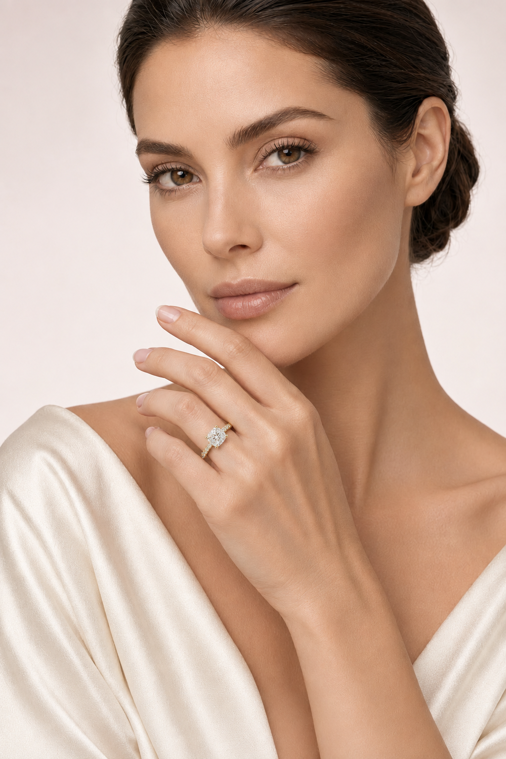 Model wearing cushion-cut engagement ring