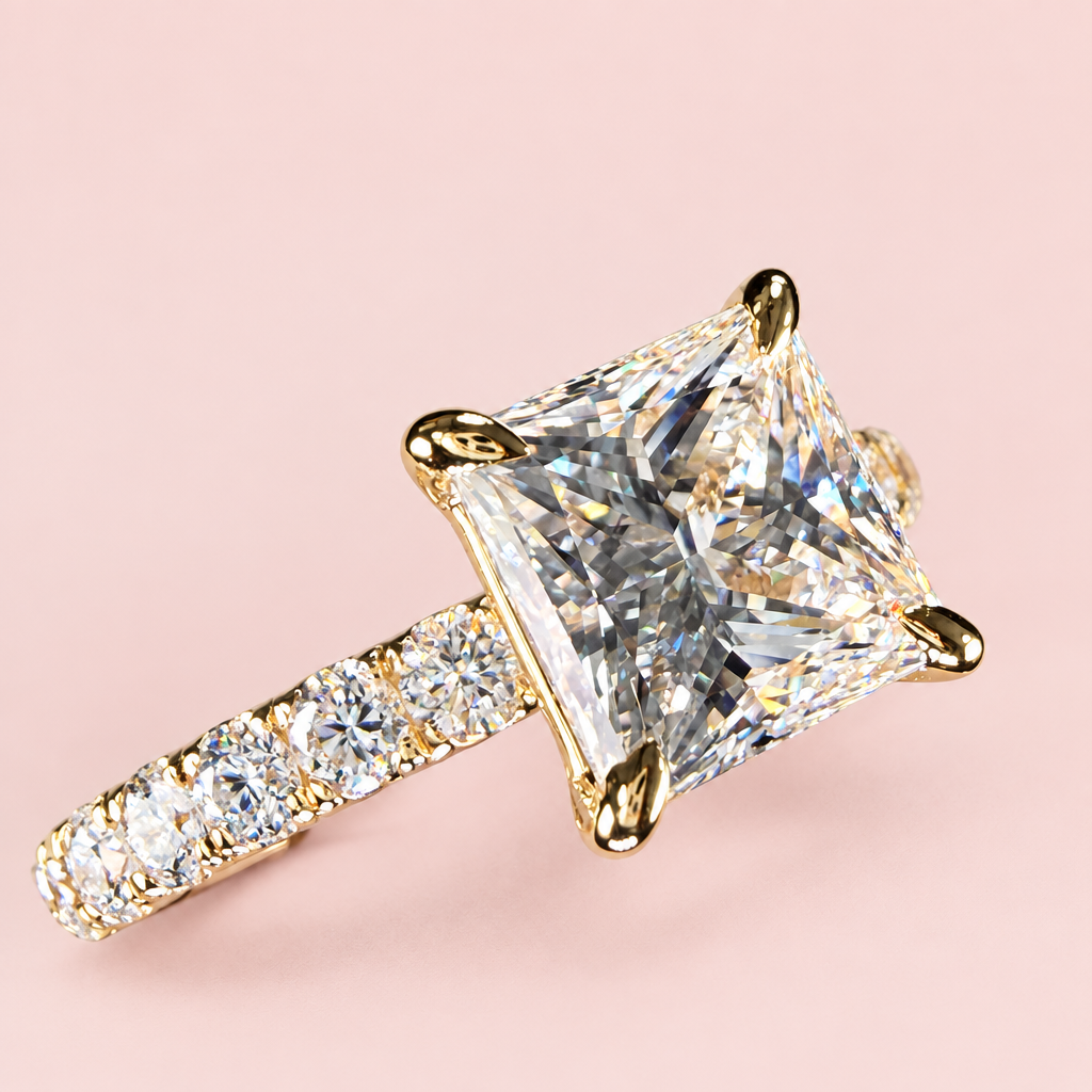 Opposite angled view of a princess-cut diamond engagement ring showing yellow-gold prongs and a diamond-set band.