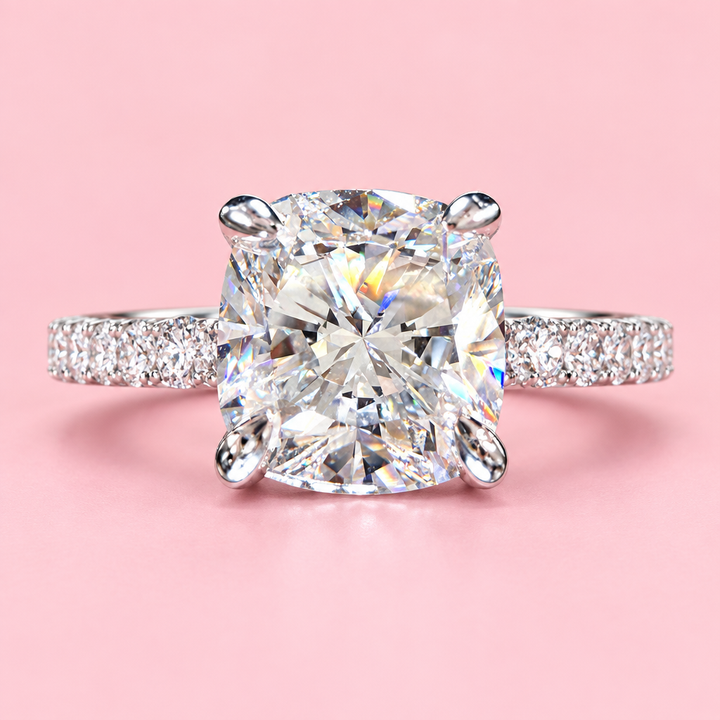 Front view of a 1.50ct cushion-cut lab diamond engagement ring with a 14K white gold pavé band.