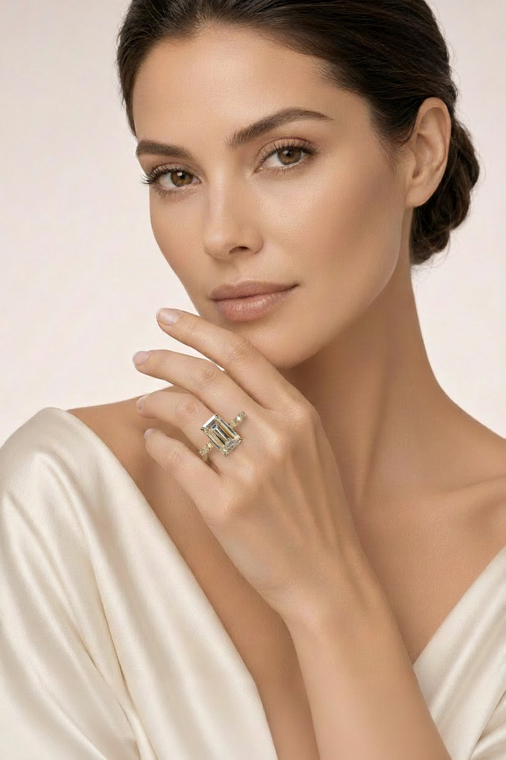 Smaller emerald-cut ring on model